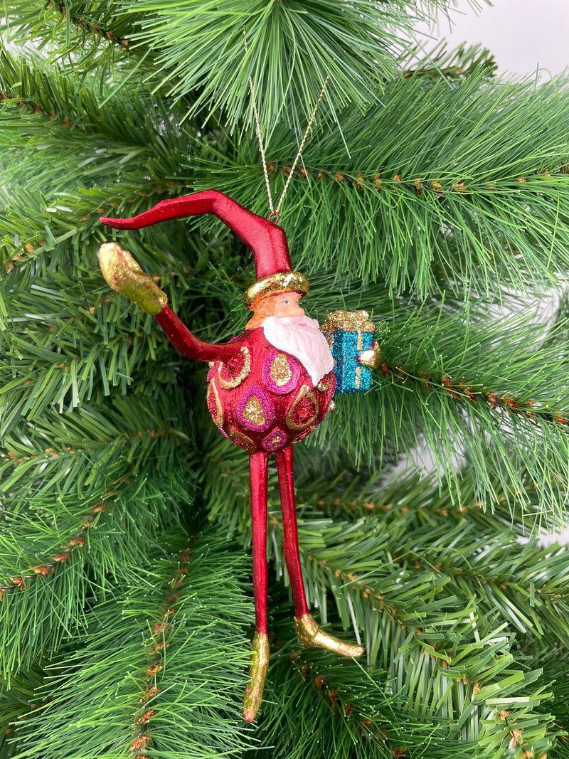 Baumschmuck  Weihnachtsmann mit langen Beinen und einem Geschenk 17 cm rot-gold Christbaumschmuck