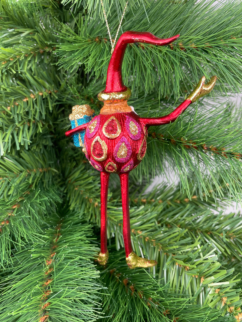 Baumschmuck  Weihnachtsmann mit langen Beinen und einem Geschenk 17 cm rot-gold Christbaumschmuck